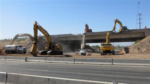Crews demolishing I-10 Bridge over Perryville road Crews demolishing I-10 Bridge over Perryville road