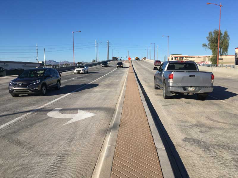 Cars on the newly opened Bell Road bridge over Grand Avenue