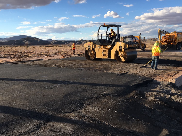 Smoothing US 89 after flood damage. Smoothing US 89 after flood damage.