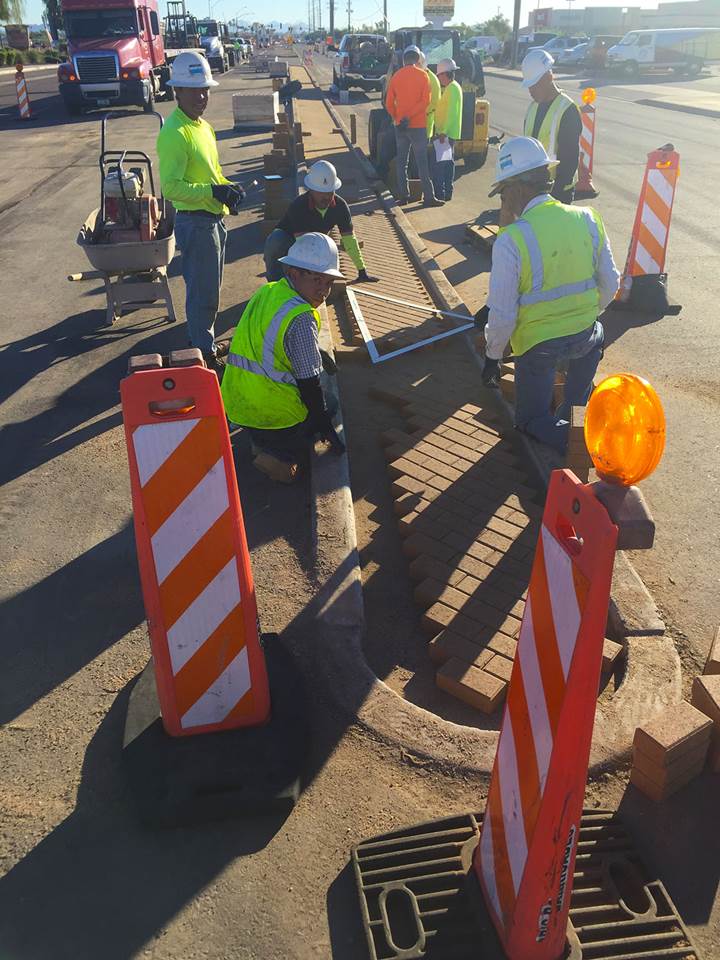 Crew adds brick to median on Bell/Grand Project