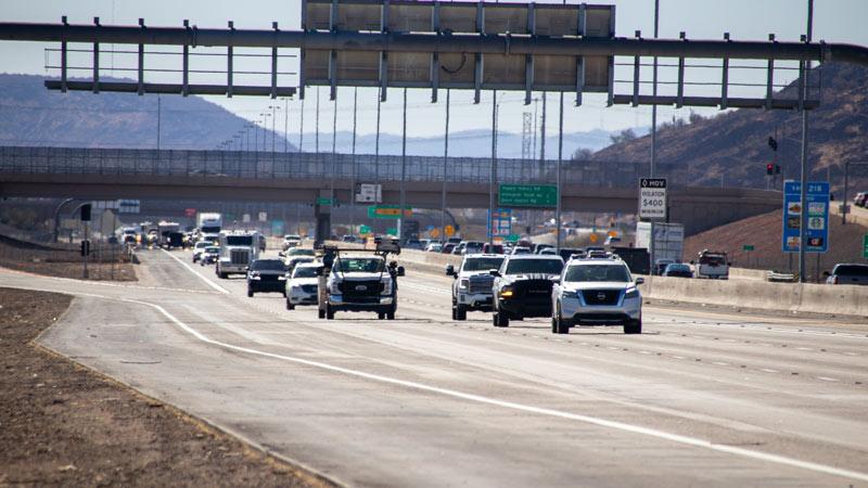 Image of multiple vehicles traveling down highway