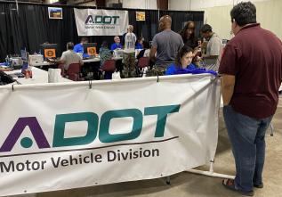 Arizona MVD staff are assisting people getting a driver license or state ID card.