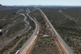 An aerial view of an interstate in a rural area.