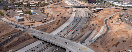 An aerial view of a highway in an urban area.