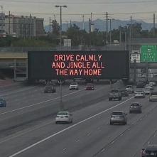 A digital message board on the highway encourages motorists to drive calmly