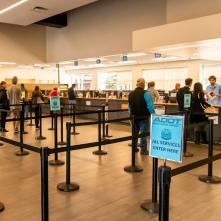 People waiting in line an an office building.