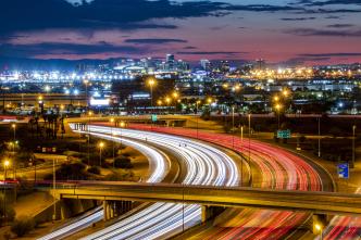 An urban freeway at night.