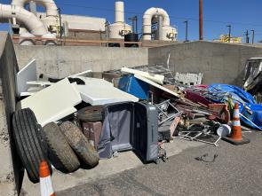 Debris removed from highways is piled up.