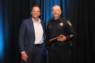 Officer Mike Dees receiving his award