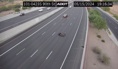 A couch in the middle of the highway