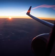 A view of an airplane flying from inside the airplane.