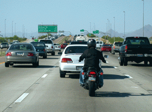 A motorcyclist driving on the highway