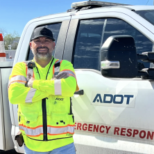 ADOT's Karl Lopez stands in front of his emergency response truck