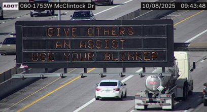 A digital message board on the highway encouraging drivers to use their blinkers