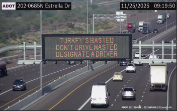 A digital message board on the highway encourages motorists to designate a driver.