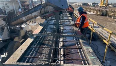 Pouring concrete to create a girder