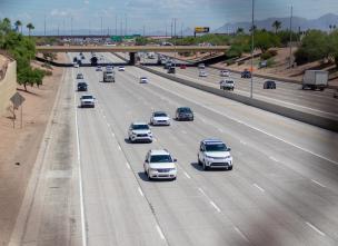 Cars driving on a highway. 