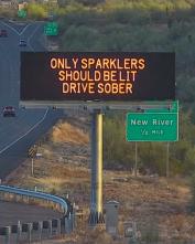 A digital message board on the highway encourages motorists to drive sober.