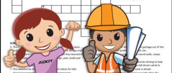 Two animated kids in construction clothing standing in front of a crossword puzzle.