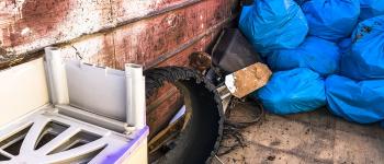 A pile of stocked up road litter in blue bags