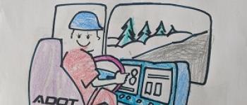 ADOT Kids Color Drawing behind the steering wheel of a snowplow