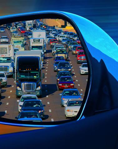 Rear view mirror looking at AZ freeway