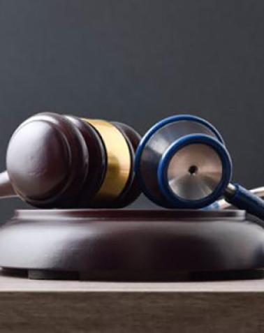 Medical review stethoscope and gavel