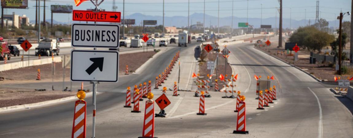 ADOT highway construction with road signage and cones 
