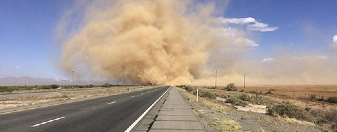 Dusty Storm coming down road.