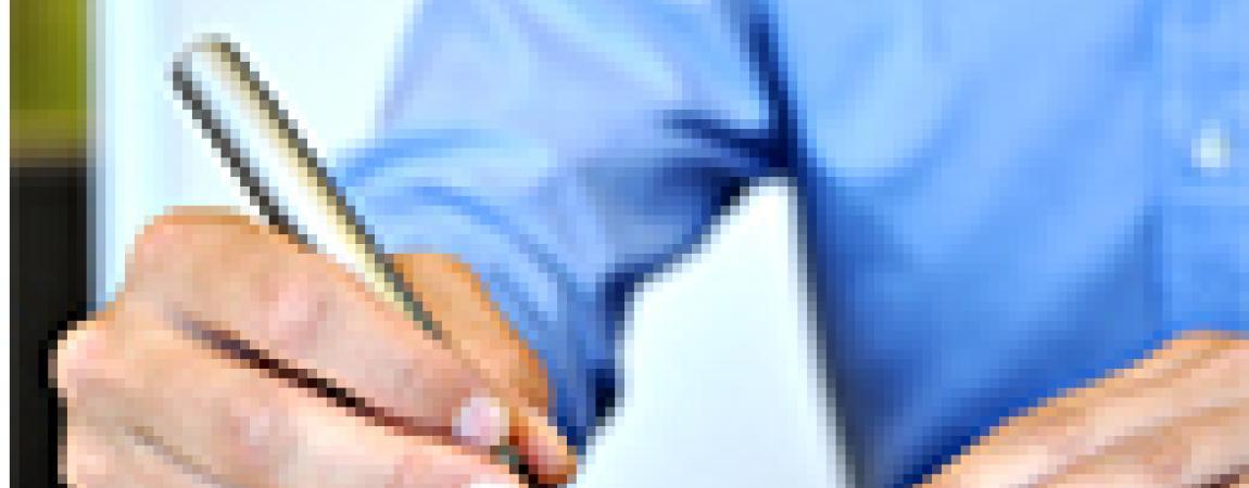 person signing a form