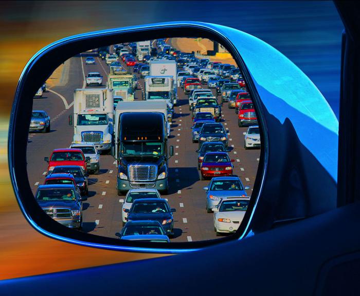 Rear view mirror looking at AZ freeway