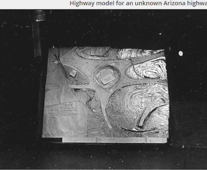 A black-and-white photograph of a highway model of a traffic circle.