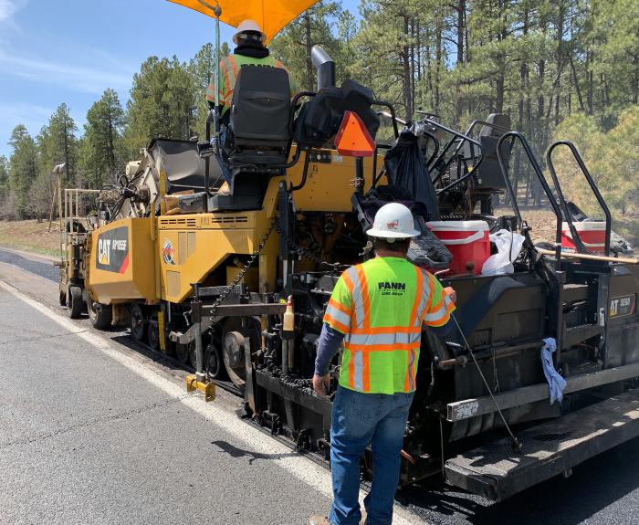 Heavy equipment repairs and replaces pavement on a stretch of highway.