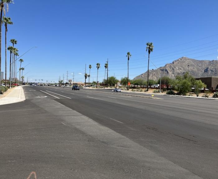 State Route 77 with new pavement lined by palm trees.