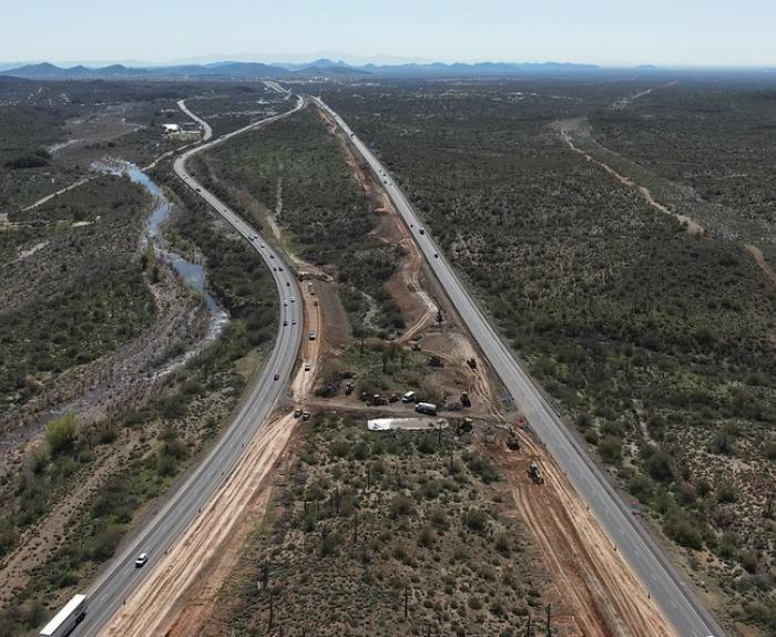 An aerial view of an interstate in a rural area.