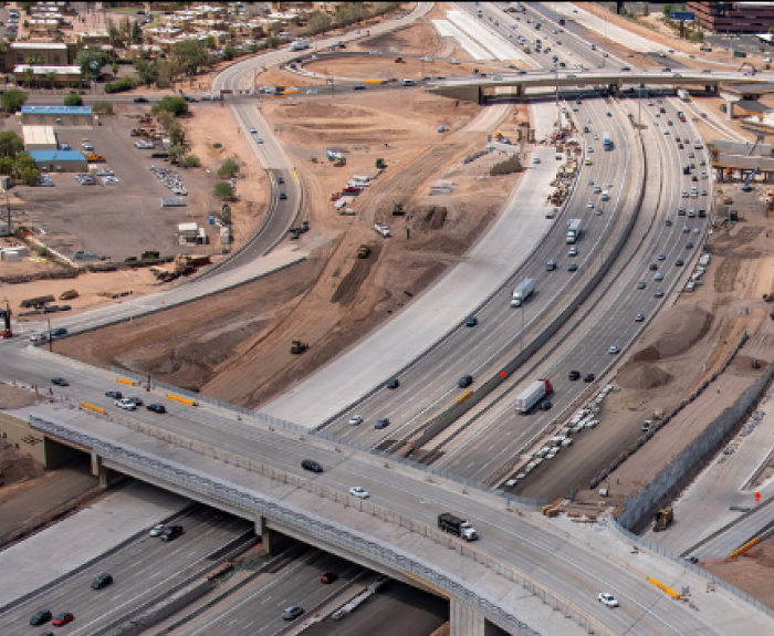 An aerial view of a highway in an urban area.