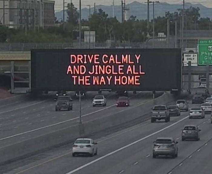 A digital message board on the highway encourages motorists to drive calmly