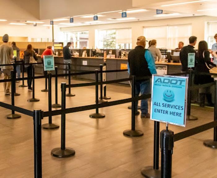 People waiting in line an an office building.