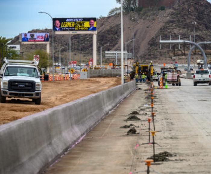 Construction zone workers along a highway