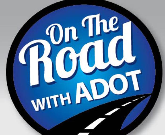 A graphic featuring a two lane road heading into a blue circle that says "On the Road with ADOT"
