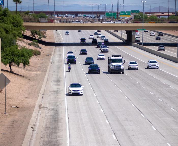 Cars traveling on an urban highway.