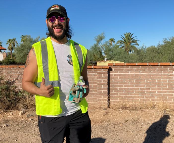 A man picks up litter.