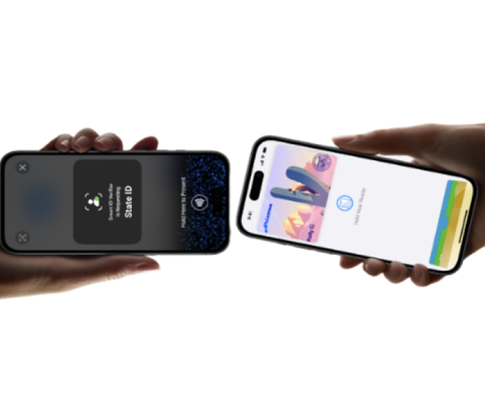 Two cell phones are being held near each other.