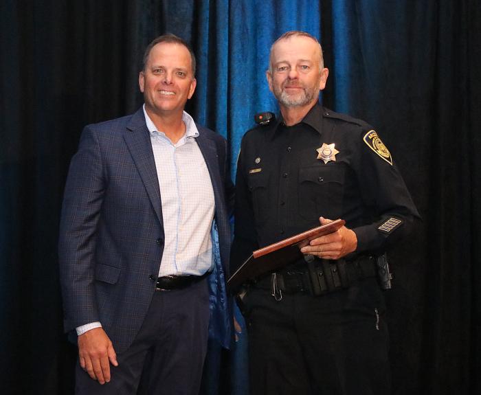 Officer Mike Dees receiving his award