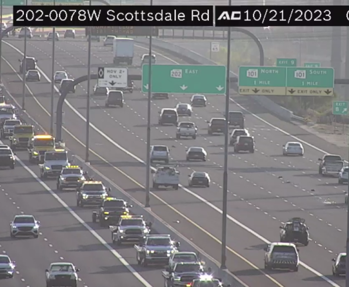 A parade of tow trucks on the highway