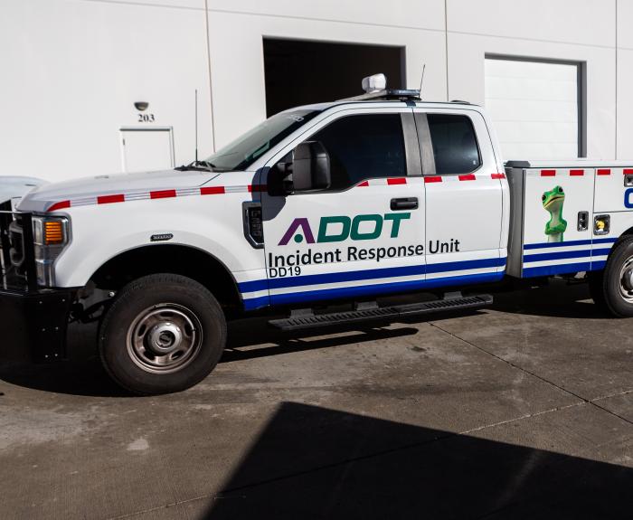 An Incident Response Unit truck in front of a building.