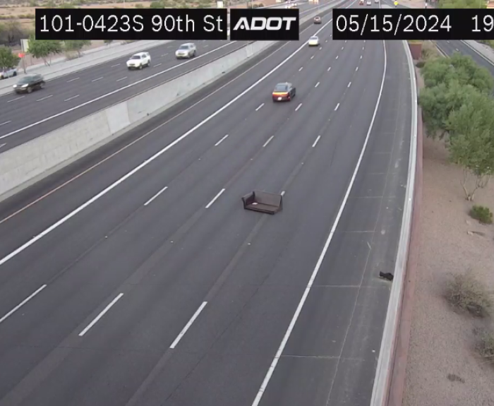 A couch in the middle of the highway