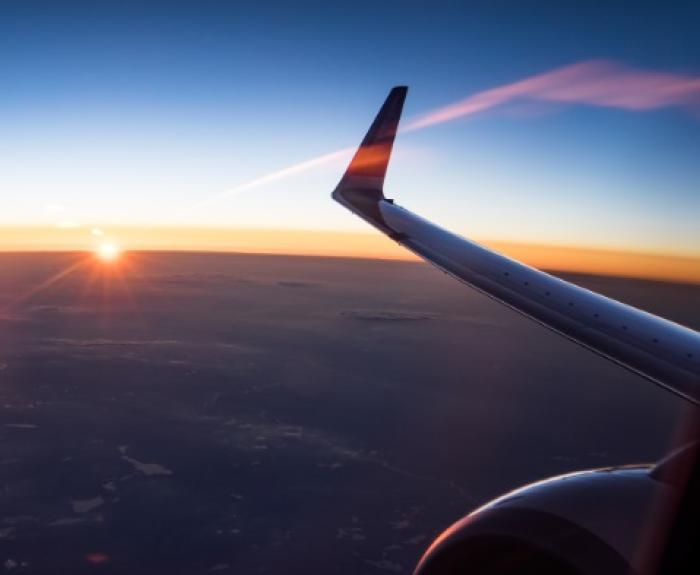 A view of an airplane flying from inside the airplane.