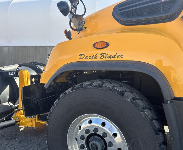 A snowplow with the name "Darth Blader" on the side. 
