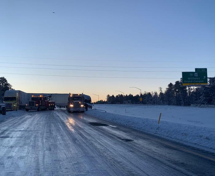 A semitruck on a snowy highway